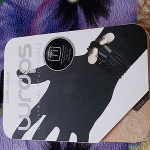 Wraps wrist headphones. Black and gold color. New with tag.